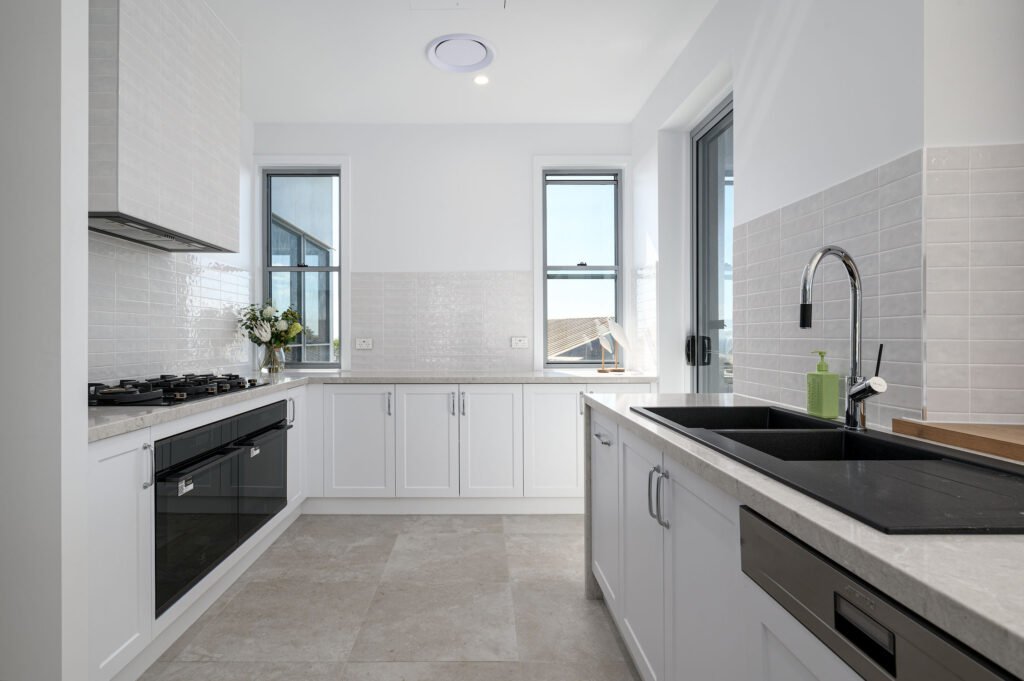 Kitchen showing glass deck access door