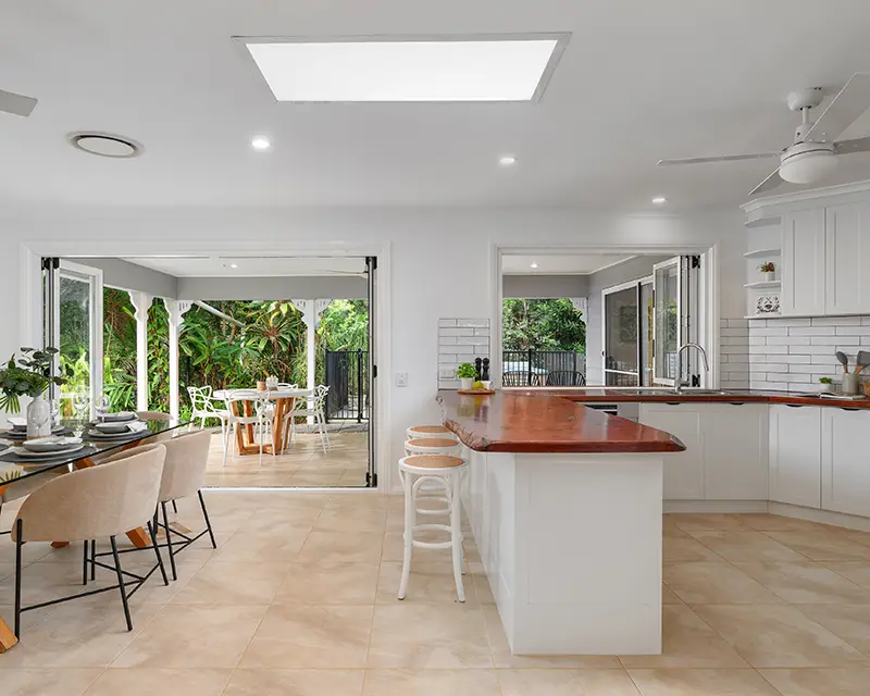 Open-plan living room with natural and interanl light – real estate photography Noosa and Gympie